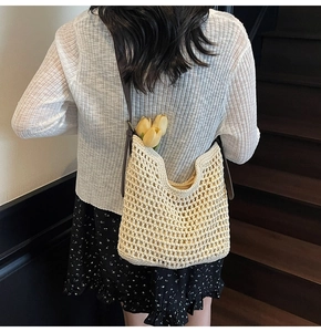 Detailed close-up of ivory cotton woven tote bag with hollow grid pattern and brown strap