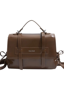 Deep brown leather messenger bag with top handle and wide shoulder strap