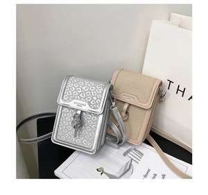 Detail of silver leopard sequins and beige woven crossbody mobile phone bags with tassels