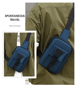 Detail of dark blue waterproof crossbody bag featuring a secure buckle and zip closure