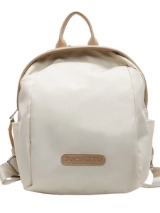 Minimalist cream white nylon backpack with adjustable straps and top handle shown on white background