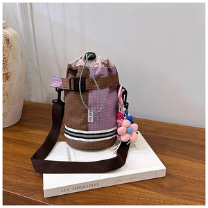 Detail of checkered cycling water bottle bag with drawstring closure and sunflower charm