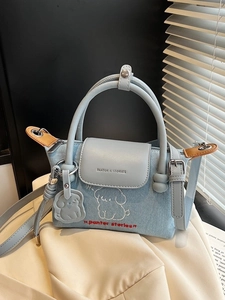 Denim light blue dumpling bag with cartoon dog embroidery and adjustable leather strap
