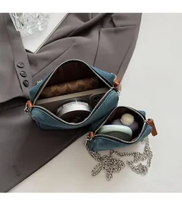 Detail view of the spacious inner compartment of this vintage denim heart embroidery bag