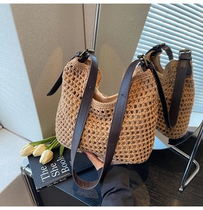 Detailed weave of khaki woven tote bag with brown leather strap and inner lining