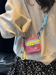 Mini mesh crossbody bag in pink and yellow with blue braided rope strap for summer