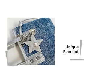 Close-up of denim bucket bag with silver leather trim and a star-shaped charm