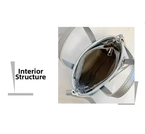 Internal structure of silver bucket bag showing dark lining and a metal zipper pocket