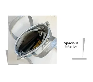 Top view of silver mini bucket bag showing spacious interior with zipper pocket