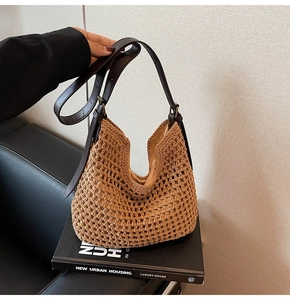 Close-up of brown crochet hobo bag with hollow knit texture and dark leather strap