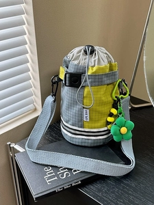 Checkered cycling water bottle bag with drawstring closure and yellow green contrast detail