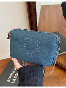 Vintage washed denim shoulder bag with white heart embroidery and silver chain strap