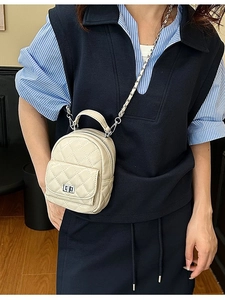 Beige quilted mini backpack with silver chain strap and front flap pocket for women