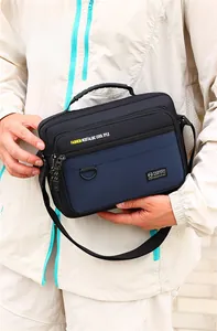 Detail of the durable oxford fabric, top handle, and adjustable strap on the shoulder bag