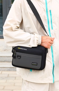 Close-up of men's casual oxford fabric crossbody bag showing textured fashion details