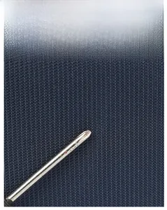 Close-up of durable navy blue oxford fabric showing honeycomb texture and scratch resistance