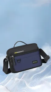 Detail of lightweight oxford fabric cross-body bag weighing only 187g with zip pockets