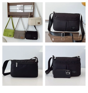 Detail view of water-resistant nylon shoulder bags with multiple zippered pockets