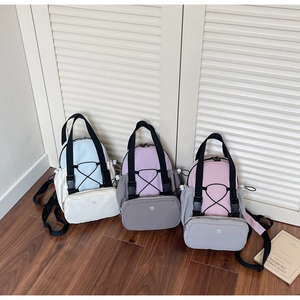 Detail of mini multi-functional backpacks with drawstring design in assorted colors
