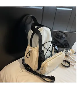 Close-up of contrast color backpack with adjustable drawstring side pockets and a small pouch