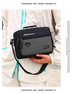 Detailed view of casual men's shoulder bag featuring multi-layer zip pockets and durable fabric