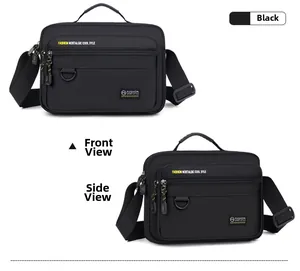 Detail view showing black oxford shoulder bag with multiple zippered pockets and D-ring