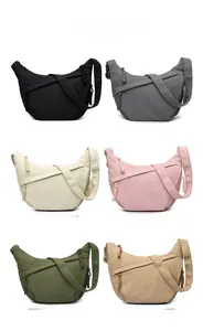 Collection of corduroy crescent crossbody bags in six various colors with zip details