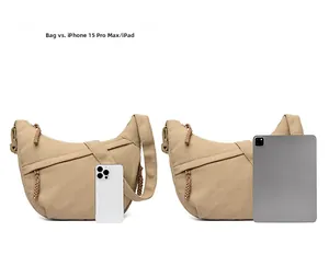 Size comparison of beige corduroy crescent bag with iPad and iPhone 15 Pro Max