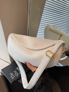 Off-white lychee leather crescent bag with adjustable shoulder strap for women