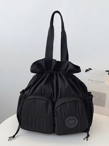 Lightweight black nylon drawstring backpack with large capacity and dual zipper pockets