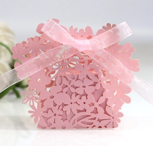 Pink laser-cut flower hollow gift box with elegant ribbon bow for wedding candy and favors