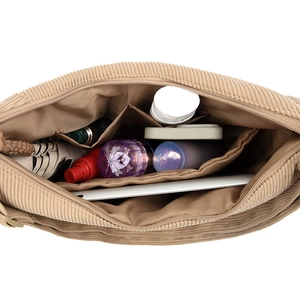 Top view of khaki corduroy shoulder bag with large capacity storing tablet and cosmetics