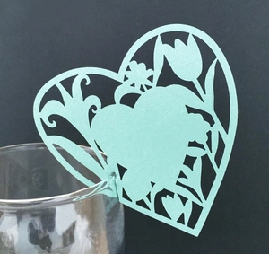 Hollow heart-shaped laser cut paper cards for wine glass decoration in mint green