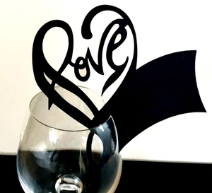 Elegant black heart Love laser cut place card inserted on rim of wine glass