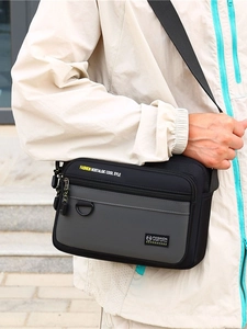 Men's casual oxford crossbody bag in black and grey with adjustable strap and multi-layers