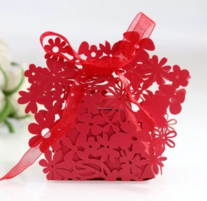 Red laser-cut hollow floral wedding favor box with ribbon for candies and gifts