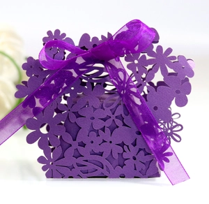Elegant purple laser-cut floral candy gift box with a matching satin ribbon bow