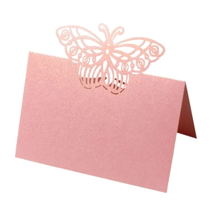 Elegant laser-cut butterfly place cards in pearlescent pink for wedding table seating