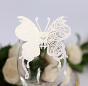 Detailed laser-cut white butterfly glass card with elegant shimmer for wedding decor