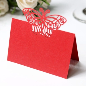 Detailed laser-cut red butterfly place card for wedding table settings and events