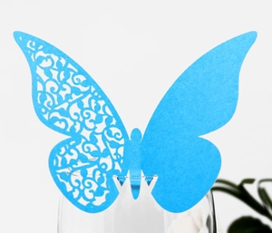 Detailed laser-cut sky blue butterfly wine glass card with intricate hollow vine patterns