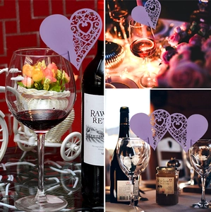 Laser-cut heart-shaped paper place cards in lilac purple for wine glass decoration