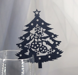 Detailed laser-cut black Christmas tree place card with star and snowflake patterns