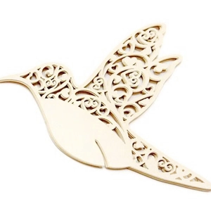 Close-up of laser-cut hummingbird place card with intricate floral heart pattern