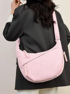 Pink corduroy crescent hobo bag for women with wide strap and minimalist design