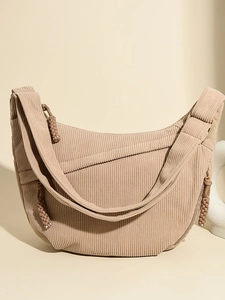 Minimalist beige corduroy crescent shoulder bag with high-quality textured finish