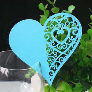 Light blue heart laser-cut place card for wine glasses with elegant scroll patterns