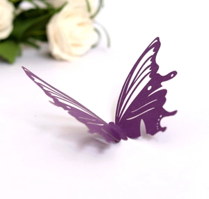 Macro shot of 3D purple laser-cut butterfly wall sticker with intricate wing patterns