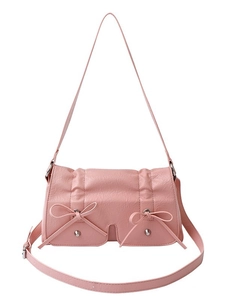 Minimalist pink PU leather crossbody bag with decorative bows and metallic studs