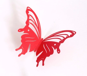 Detail of red 3D butterfly wall stickers with laser-cut hollow patterns and glitter finish